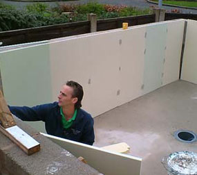 Foam being applied to the pond walls